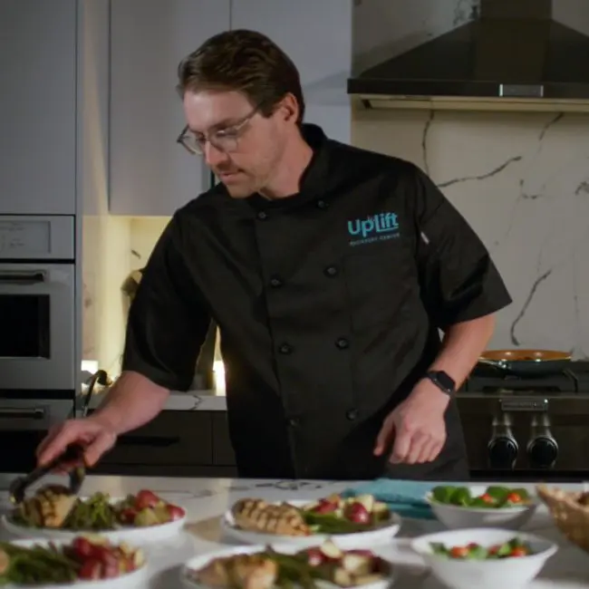 A personal chef preparing a delicious meal at Uplift Recovery Center
