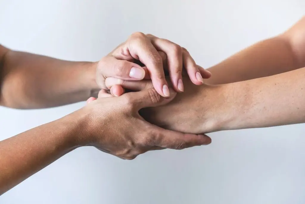 two hands embracing each other