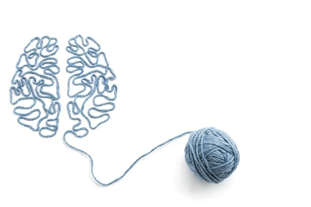 Yarn forming the outline of the brain, symbolizing ketamine addiction
