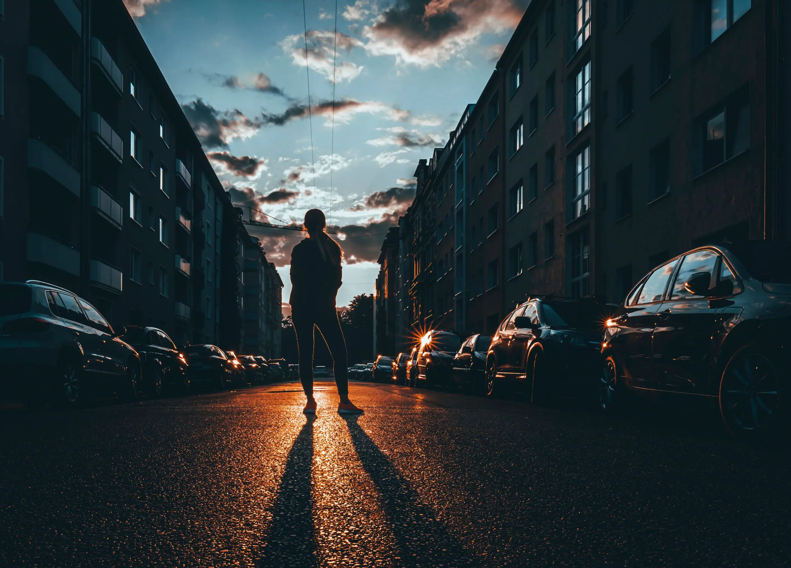 silhouette of a woman standing in the street as a metaphor for street names for drugs