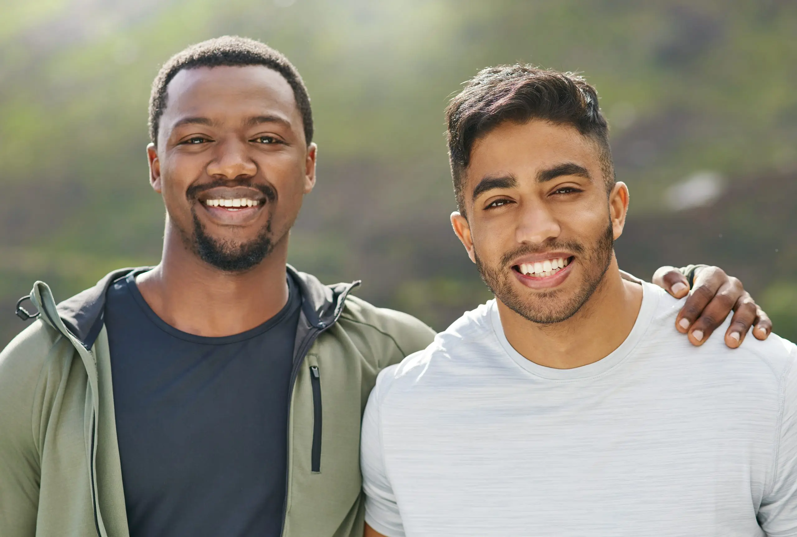 two guys smiling, showing the power of friendships in recovery