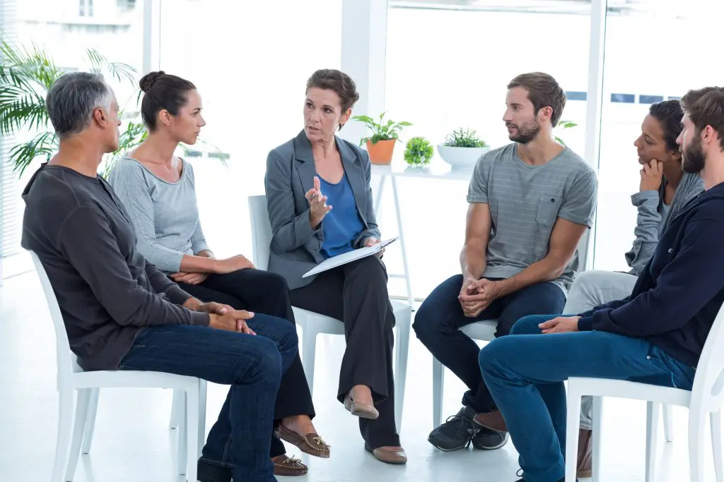12-step vs non-12-step rehab group meeting