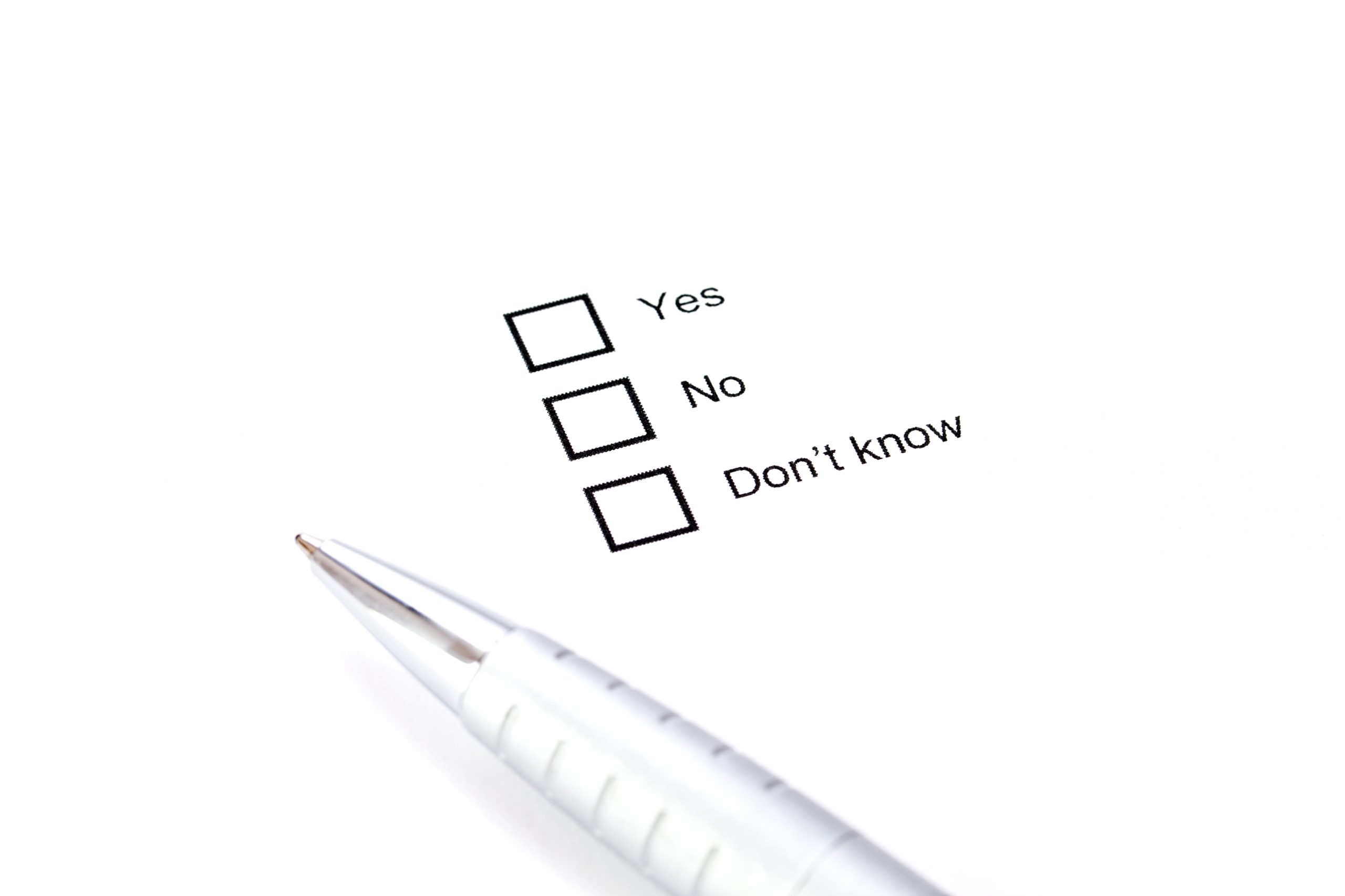 a pen with a question concept: yes, no, I don't know. This symbolizes the enabling an addict question