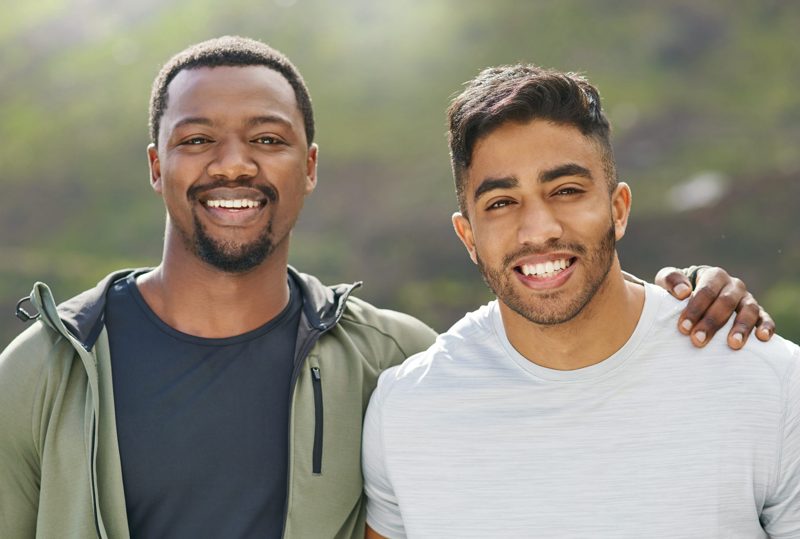 two guys smiling, showing the power of friendships in recovery