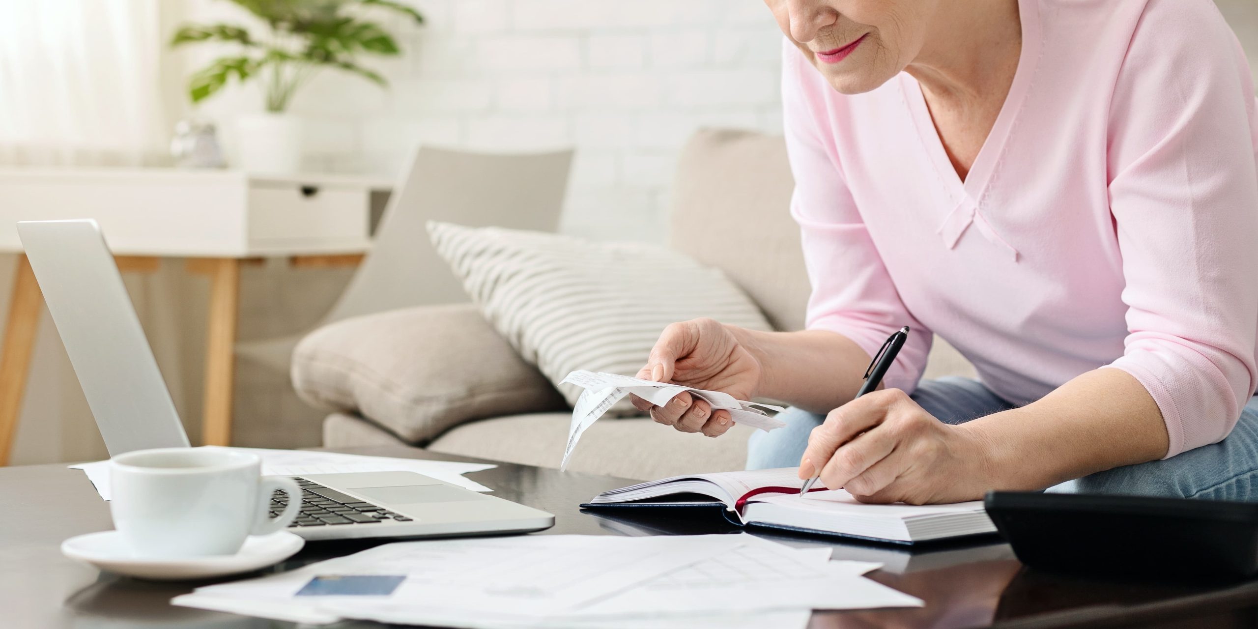 Person working on budgeting in recovery for a healthy lifestyle